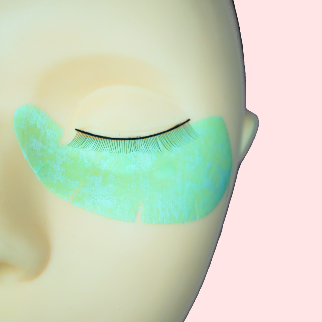 Green eye gel pads on mannequin for lash extensions